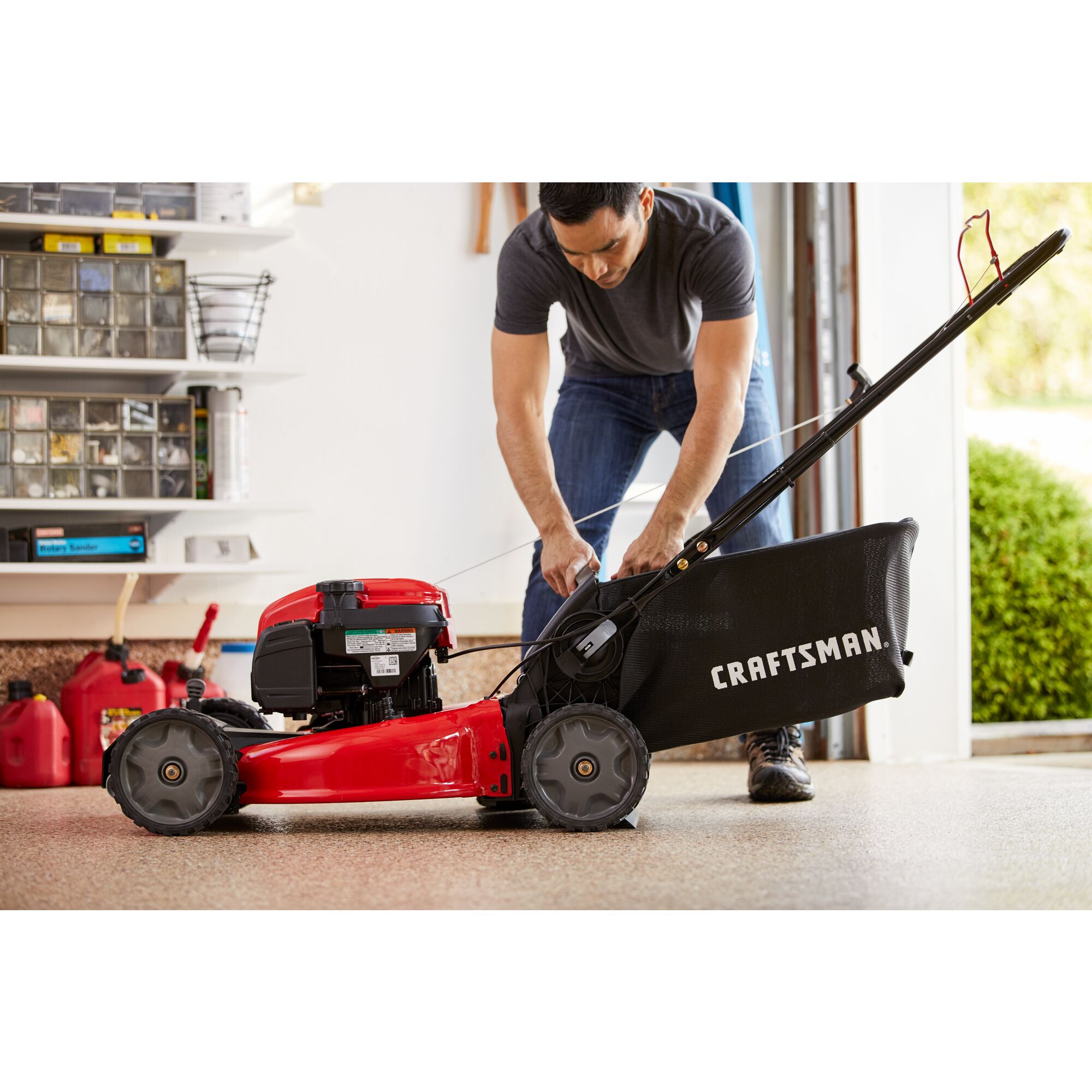 CRAFTSMAN M260 21-IN.163cc Fwd Self-Propelled Mower zoomed in being prepared for vertical storage
