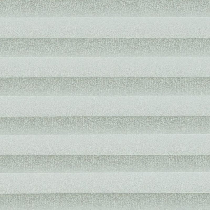 Cellular pleated blinds, fully lowered with evenly spaced pale gray-green horizontal bands, filtering diffuse daylight across a neutral interior and creating soft, uniform illumination.