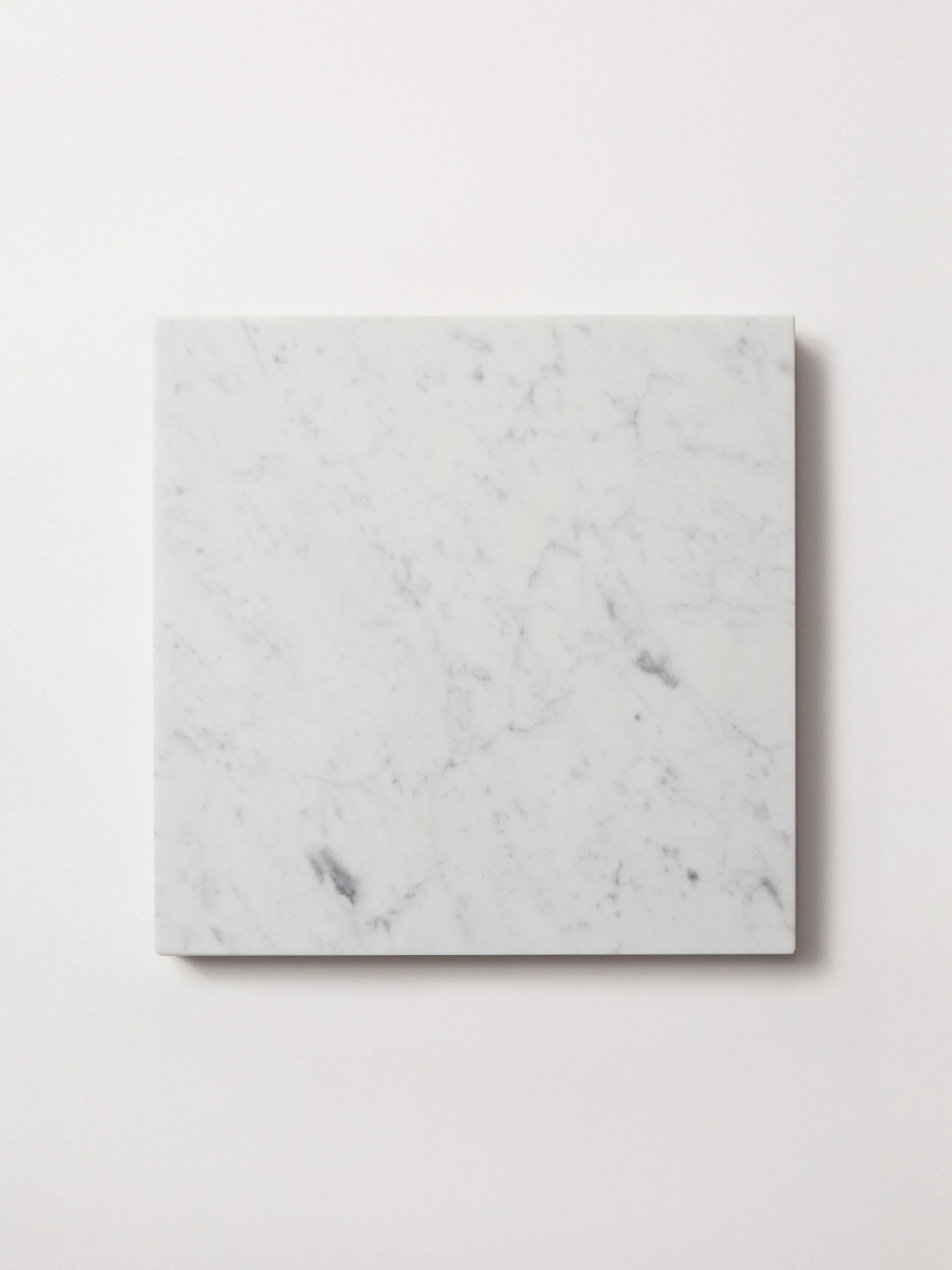 a white marble square on a white background.