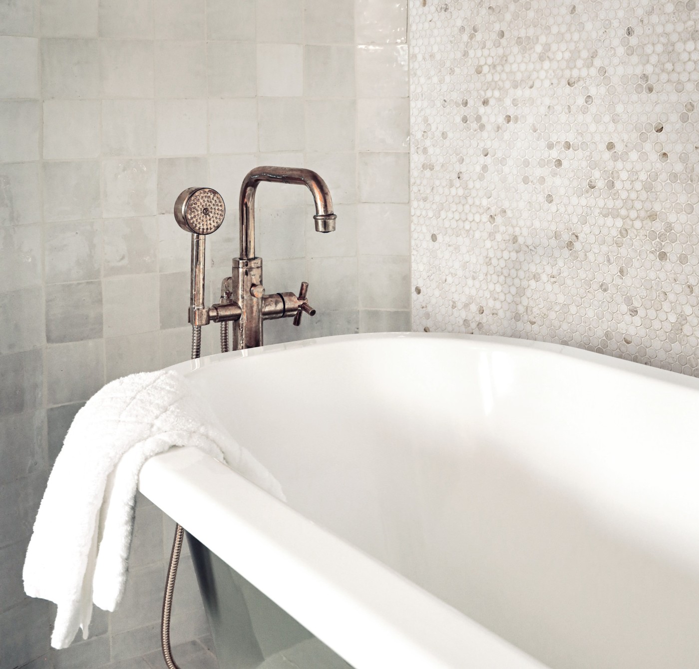 a white bathtub in a bathroom.