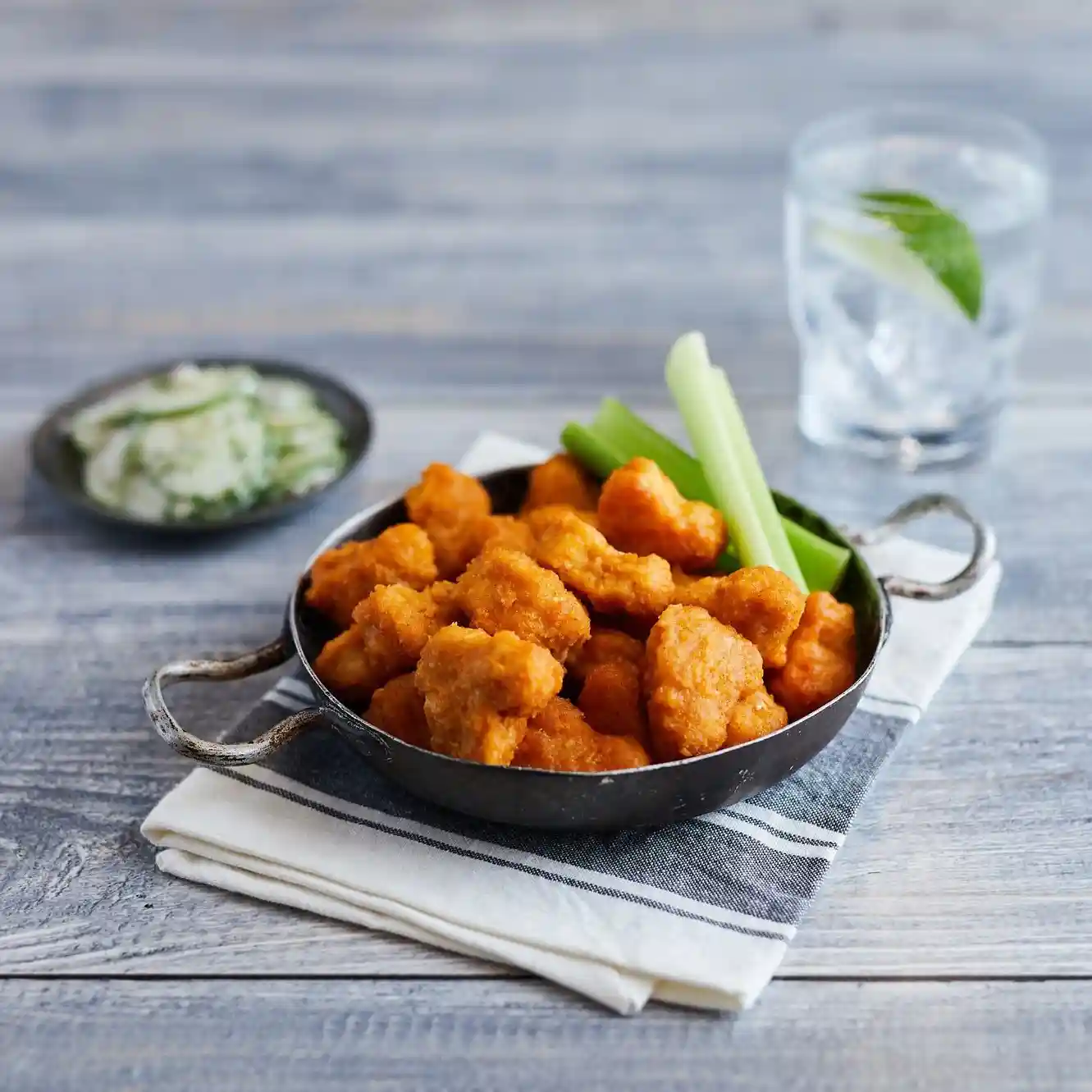 Tyson® Mega Minis® Fully Cooked Whole Grain Breaded, Glazed Nashville Hot Style MWWM Chicken Breast Chunks CN, 0.45 oz.  https://images.salsify.com/image/upload/s--u3RcmL1O--/q_25/qzhhbnmlynmtl6ykbfzz.webp