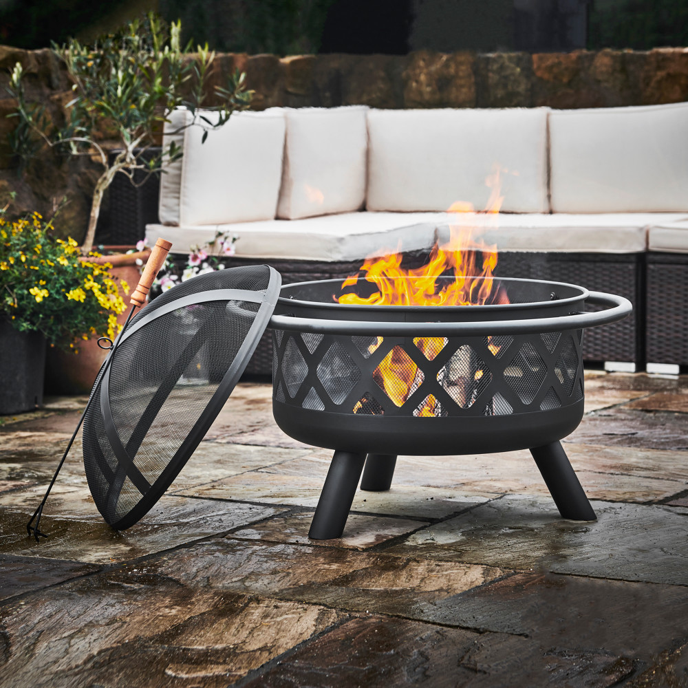 Cosy autumn firepit setup with pumpkins