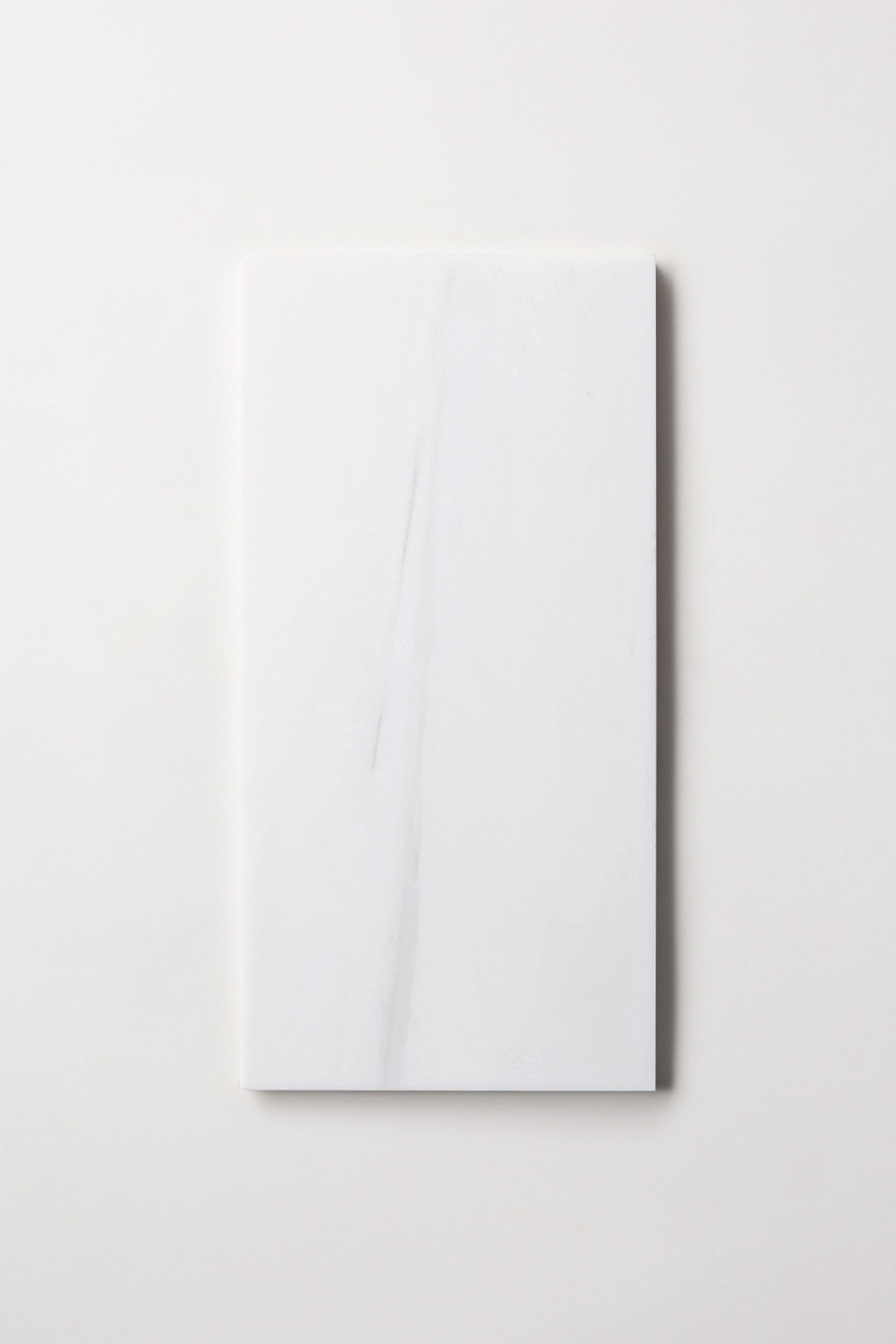 a white rectangle tile on a white background.