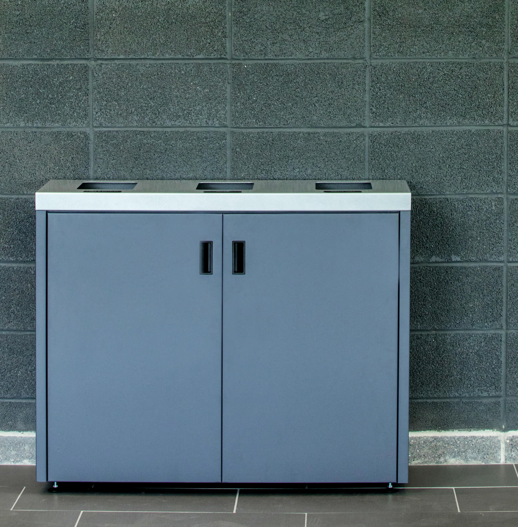 powder coated steel waste and recycling bin with three collection streams in a college campus