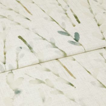 Light, folded curtain fabric with watercolor green leaf sprigs, draping in a horizontal fold; filtering soft light, photographed close-up to show linen texture and subtle botanical print.