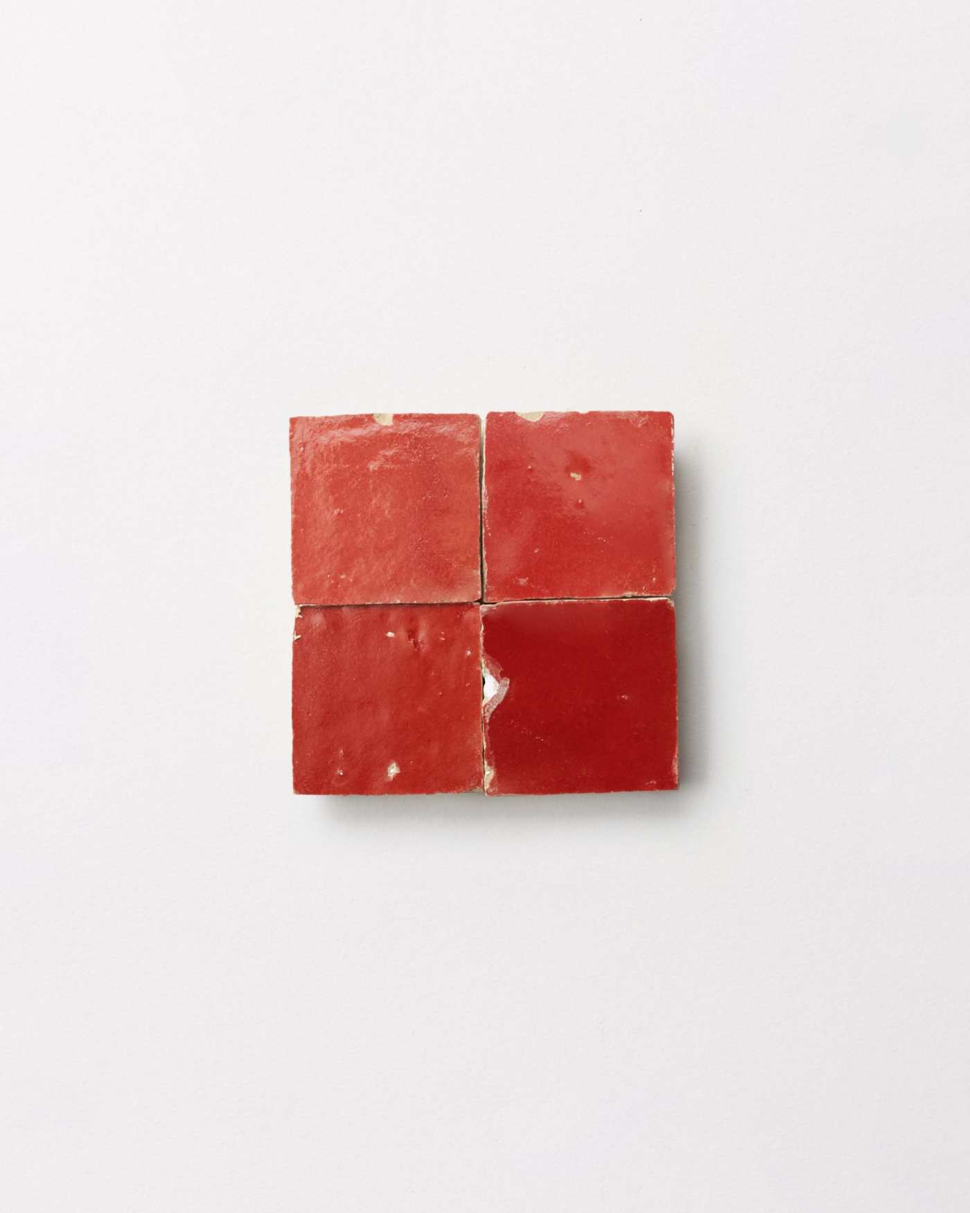 red tiles on a white surface.