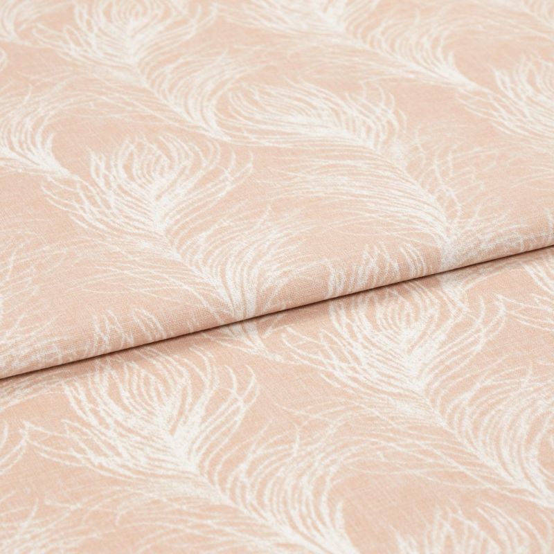 Folded peach-pink curtain fabric with white featherlike pattern, folded once across the frame, displaying woven texture; close-up studio view emphasizing soft, muted tones and subtle pile.