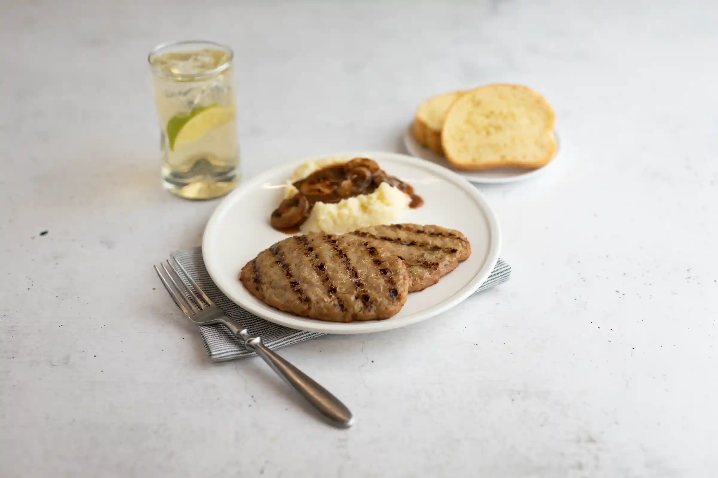 AdvancePierre™ Fully Cooked Down Home Charbroil Beef Salisbury Steak, 3.2 oz https://images.salsify.com/image/upload/s--EAzCbhV2--/q_25/waxgckvmcmwsnoecdagn.webp