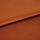 Copper-orange satin fabric, folded with visible edge, reflecting light — close-up studio shot showing soft sheen, fine texture, and warm even lighting.