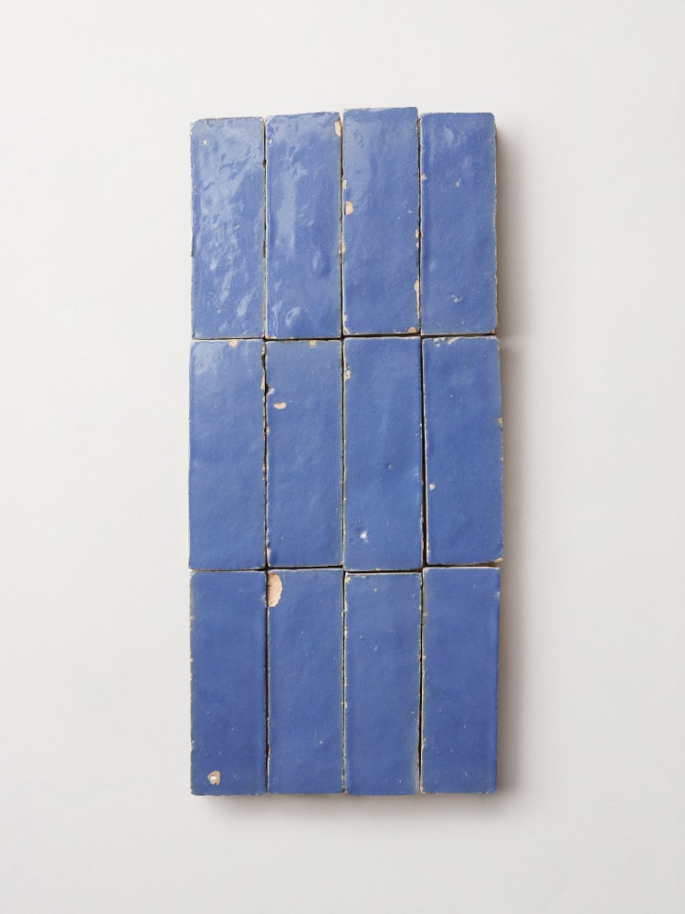 blue tiles on a white surface.