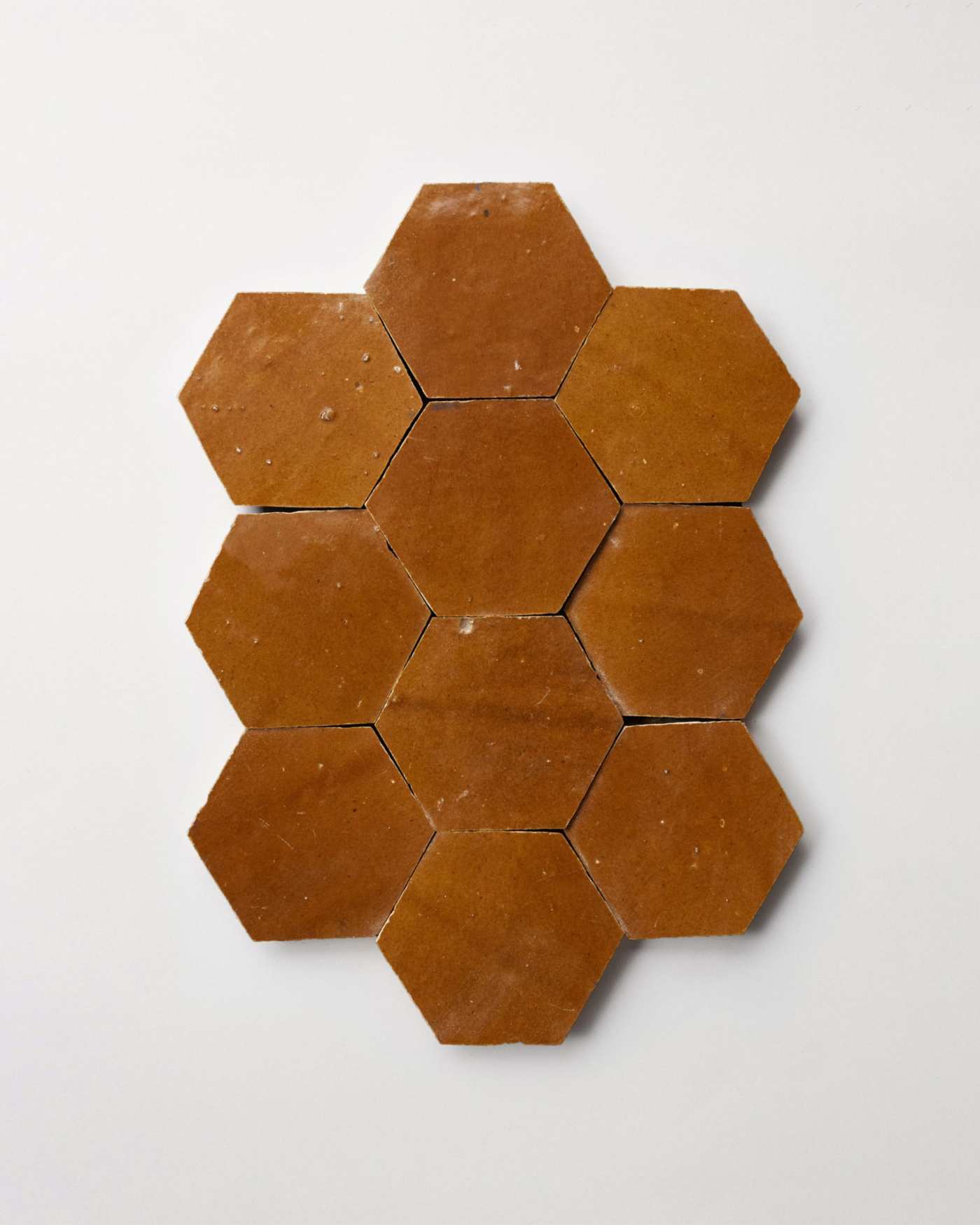 a set of brown hexagon tiles on a white background.