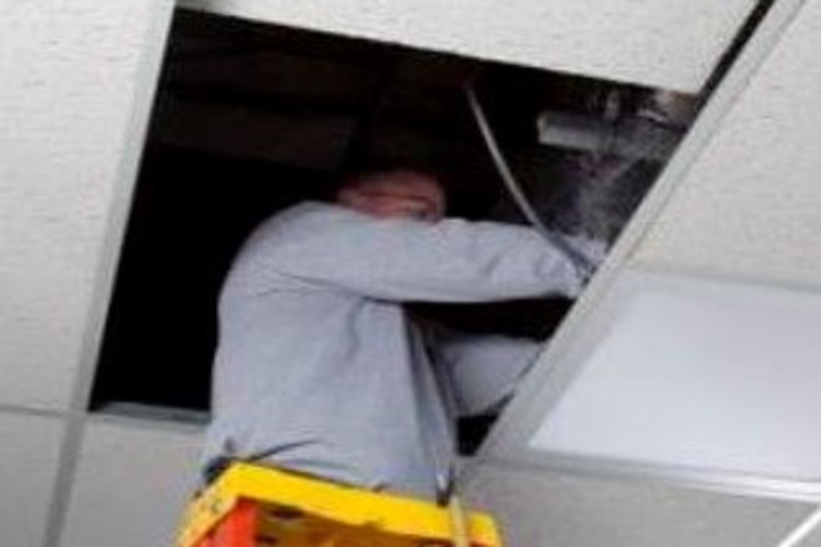 Electrical Contractor installing Lumination LED Fixtures with Daintree Integrated Wireless Lighting Controls