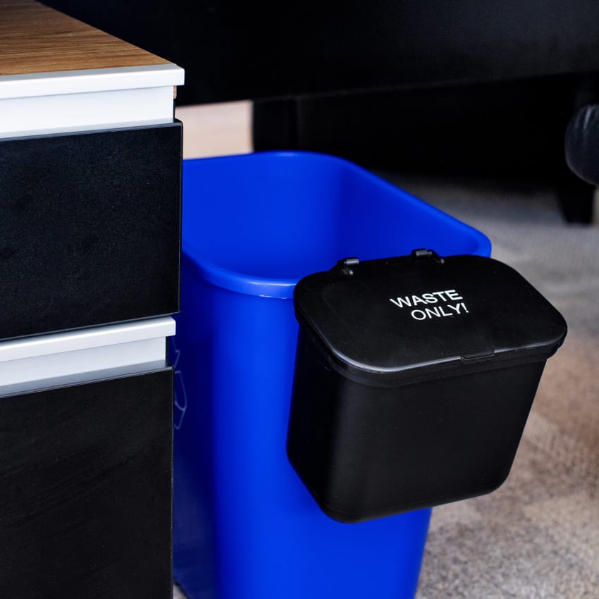 hanging waste basket for the side of a recycling container with waste only on the hinged lid for office waste collection