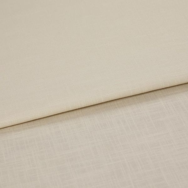 Beige woven fabric panels folded over one another, overlapping to reveal two subtle textures; shown in a close-up with even, neutral lighting on a flat surface.
