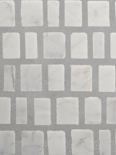a white marble tile with squares on it.