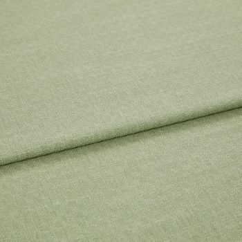 Pale green woven fabric folded once, showing a horizontal overlap and subtle textured weave; lying flat in soft, even studio lighting with a neutral background.
