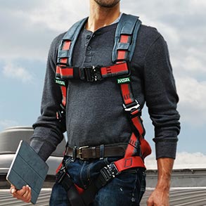 PErson wearing an orange safety harness