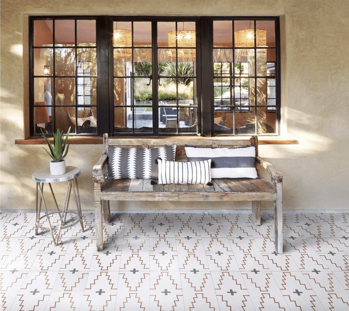 a bench in front of a window with a tiled floor.