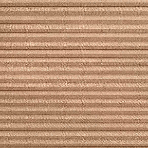 Tan pleated fabric blinds, tightly closed with evenly spaced horizontal folds, blocking the view and diffusing light, filling the frame against a neutral interior with soft, even lighting.