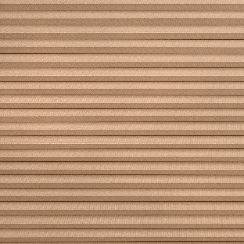 Tan pleated fabric blinds, tightly closed with evenly spaced horizontal folds, blocking the view and diffusing light, filling the frame against a neutral interior with soft, even lighting.