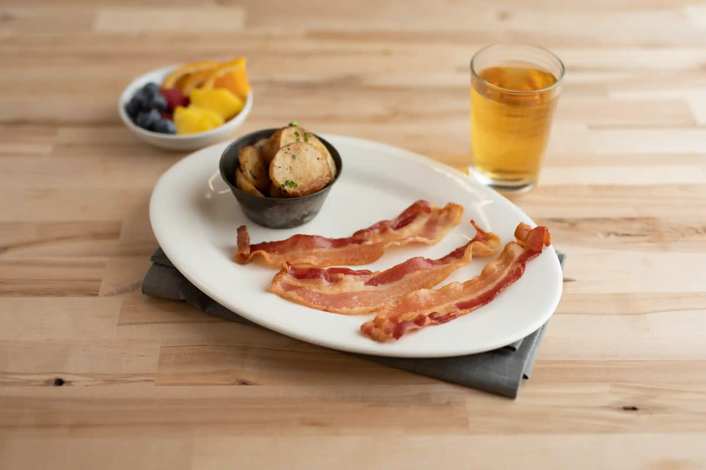 Wright® Brand Naturally Applewood Smoked Regular Sliced Bacon, Flat-Pack®, 15 Lbs, 14-18 Slices per Pound, Gas Flushed https://images.salsify.com/image/upload/s--JoKb4aGN--/q_25/ca7adfabeedbf7a5b95f618806a16c726ef98eb9.webp