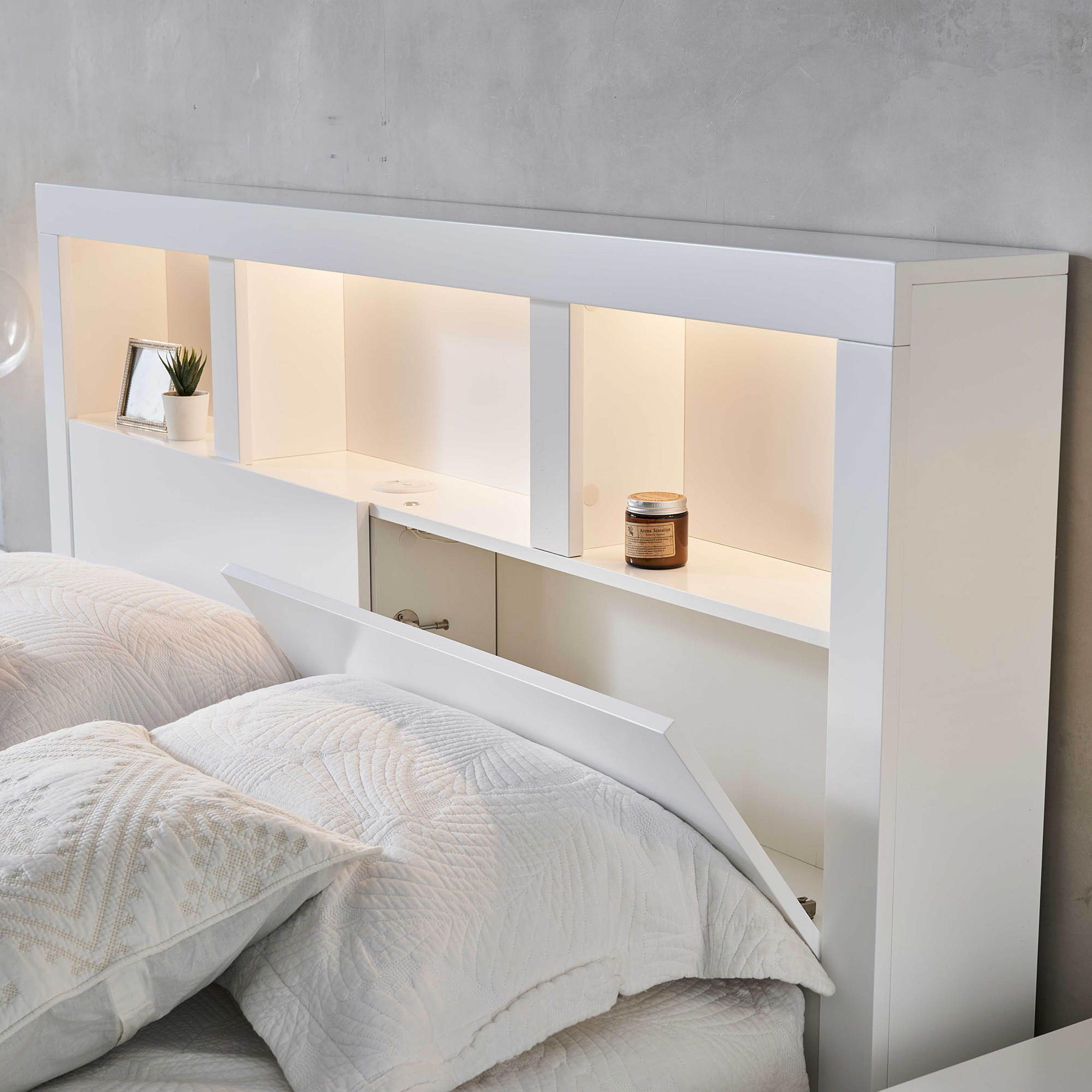 Lifestyle image of the  Lugano Bed Frame, Front Slat Gas Lift & End Drawer Base, Ivory White from Forty Winks