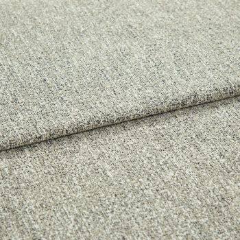 Beige speckled woven fabric upholstery swatch folded once, overlapping edge visible; close-up showing textured weave and low pile, neutral studio lighting on a flat surface.