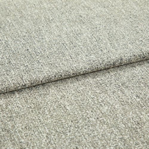 Beige speckled woven fabric upholstery swatch folded once, overlapping edge visible; close-up showing textured weave and low pile, neutral studio lighting on a flat surface.