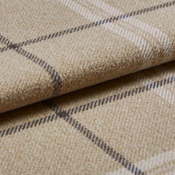 Beige wool plaid blanket with thin dark and white checks, folded in layers; resting on a matching fabric surface; close-up shot emphasizing textured fibers and soft, diffuse lighting.