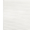 White honeycomb (cellular) pleated blind fully lowered, tightly folded horizontal cells; closed and diffusing light, shown against a bright white background in even studio lighting.