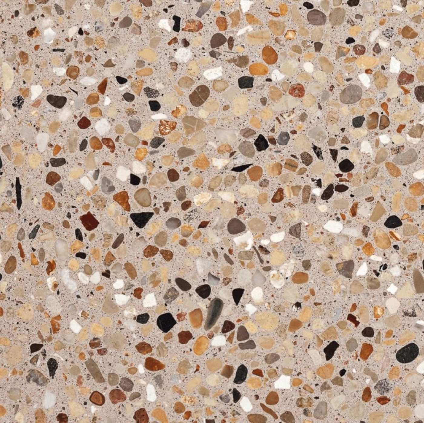 a close up image of a beige and brown tile with a speckled pattern.