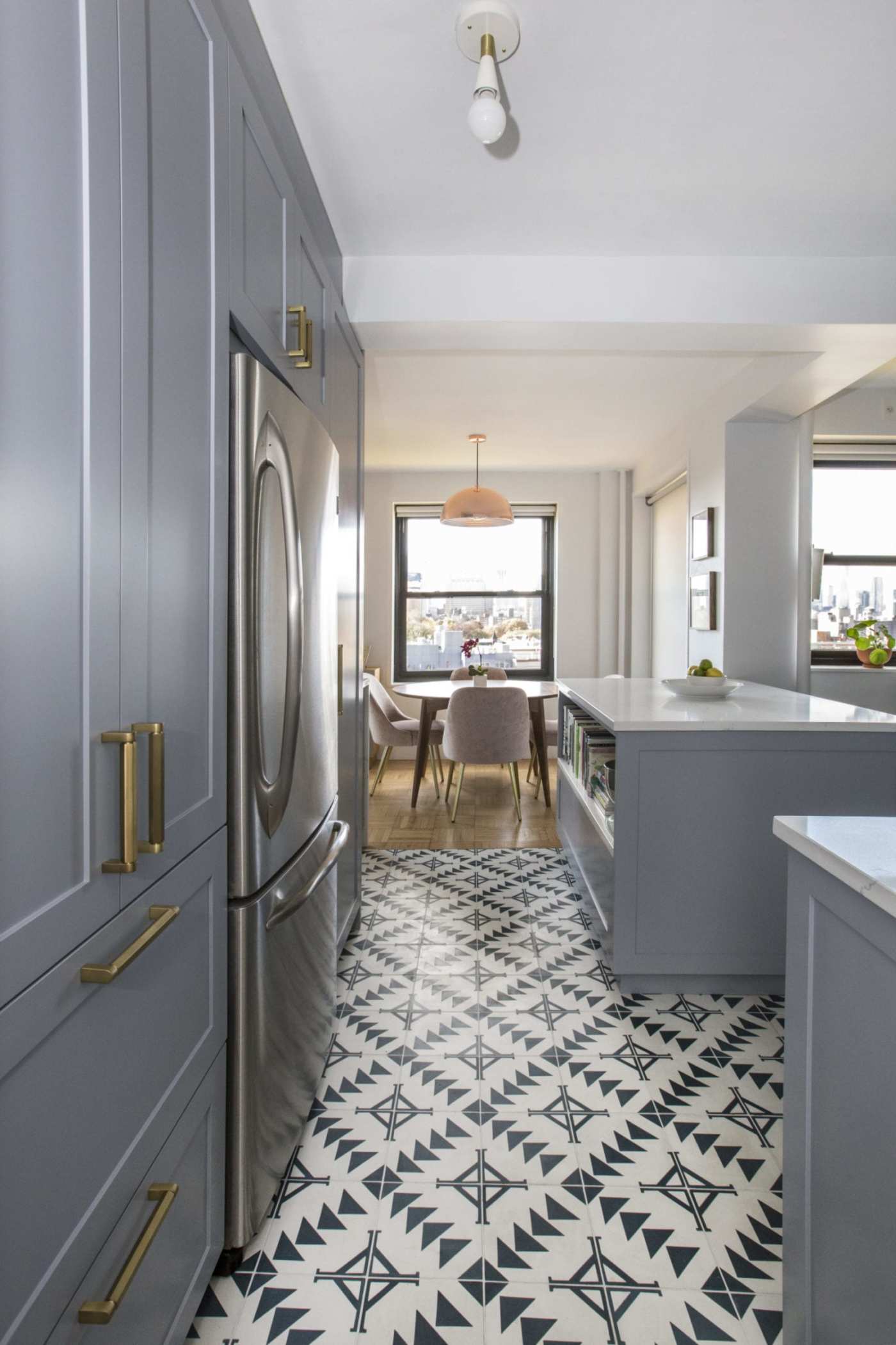 a kitchen with a blue and white tile floor.