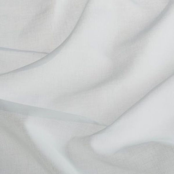 Sheer white curtain fabric, layered and draped in soft folds, gently filtering diffuse daylight; close-up interior window treatment showing subtle linen texture and delicate translucence.