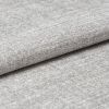 Gray woven upholstery fabric folded in a neat horizontal overlap, revealing a textured weave and soft pile; close-up studio view with even, diffuse lighting and a neutral background.