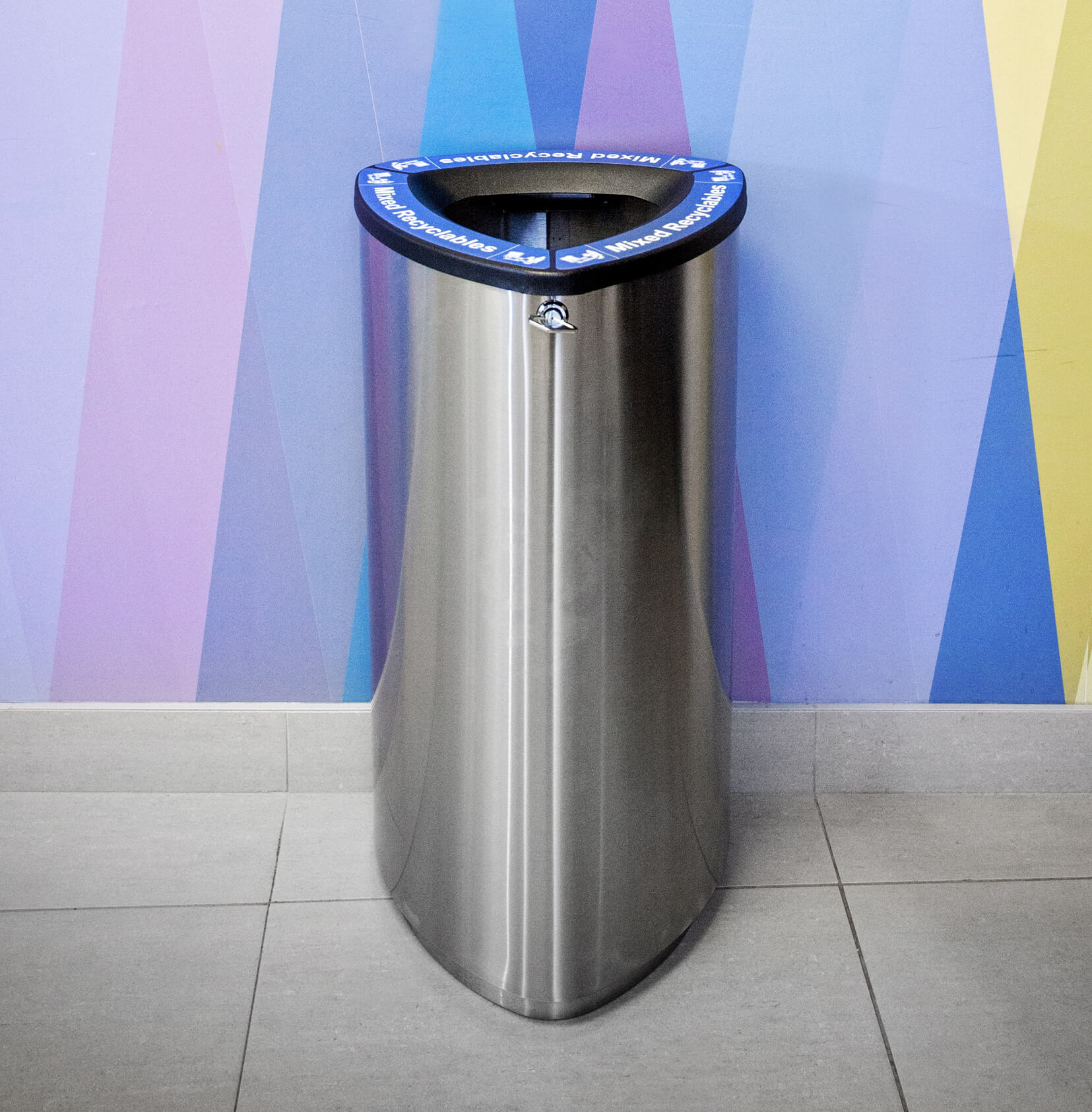 single mixed recyclables stainless steel bin in a shopping plaza