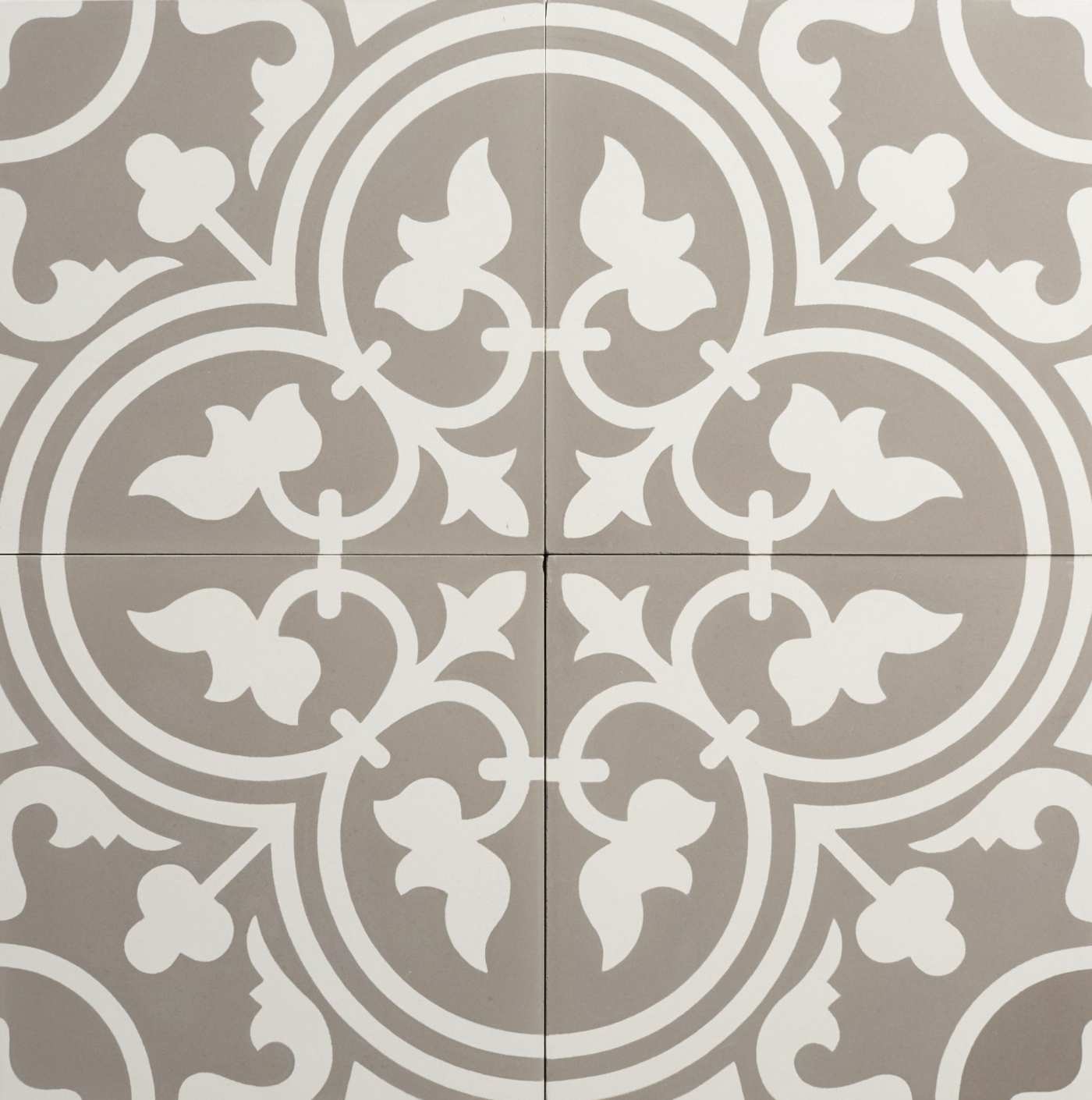 four grey and white tiles forming an ornate design.