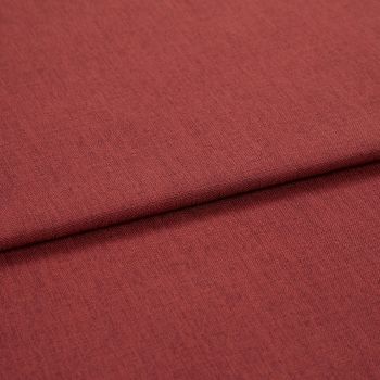 A folded red-brown woven upholstery fabric, folded once across the frame; fine, even weave visible, shown in close-up with soft, even studio lighting.
