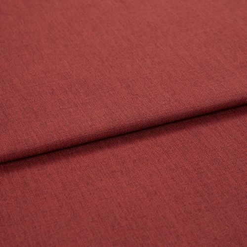 A folded red-brown woven upholstery fabric, folded once across the frame; fine, even weave visible, shown in close-up with soft, even studio lighting.