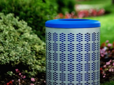 silver powder coated steel body with blue plastic lid and liner for collecting recycling in a city park