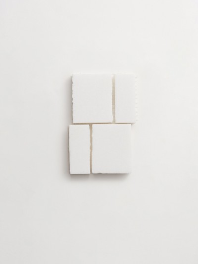 a set of white squares on a white surface.