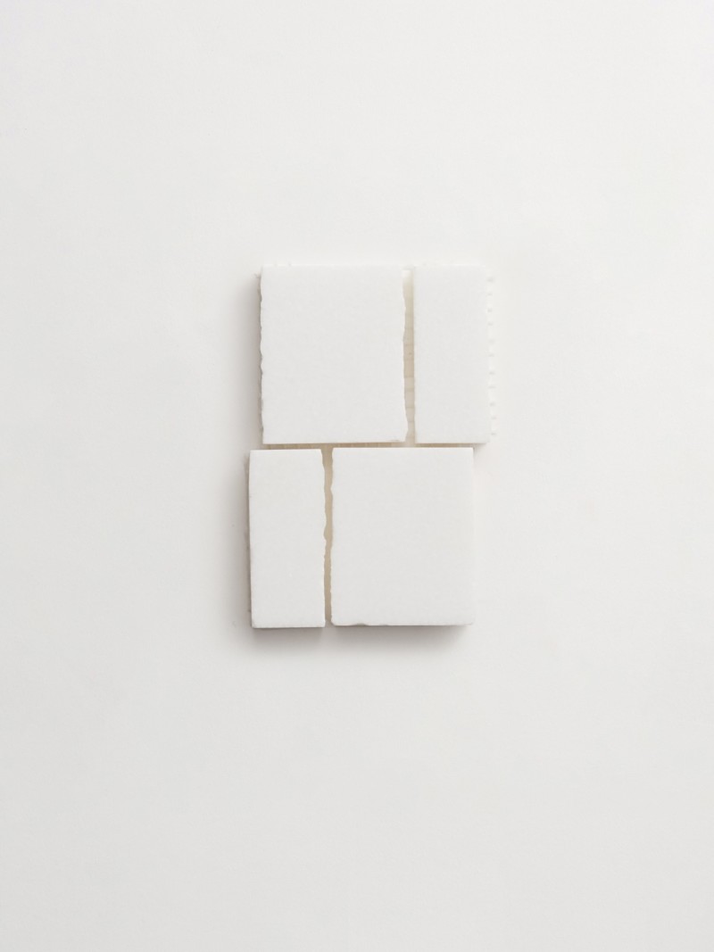 a set of white squares on a white surface.