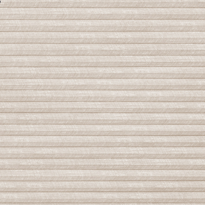 Beige pleated cellular blind covering entire frame, fully lowered and closed with horizontal folds; filtering soft diffuse indoor light against a textured fabric surface.