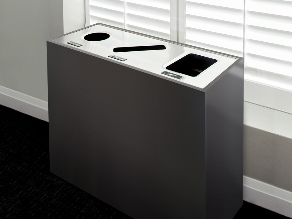 triple waste and recycling container with stainless steel lid and melamine body in a modern corporate office