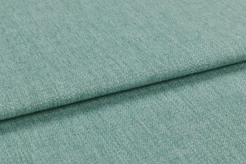 A folded teal-green textured upholstery fabric, layered with a visible fold across the frame; close-up view showing woven pile under soft, even studio lighting.