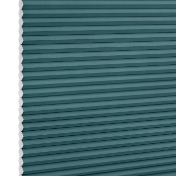 Teal honeycomb (cellular) blind, fully lowered with visible white hexagonal cell edges, closed over a window; minimalist product-style setting with even, neutral lighting.