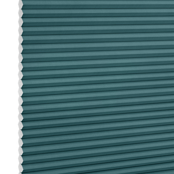 Teal honeycomb (cellular) blind, fully lowered with visible white hexagonal cell edges, closed over a window; minimalist product-style setting with even, neutral lighting.