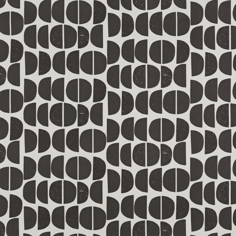 Wallpaper featuring repeating black semicircles and vertically bisected circles, arranged in alternating columns; shapes appear slightly distressed, creating a mid-century geometric pattern across a pale gray background.