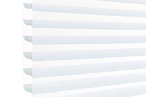 Layered horizontal zebra blinds—alternating opaque white and sheer pale-blue bands with scalloped left edge—filtering soft daylight across a window, bright minimal interior with high-key lighting.