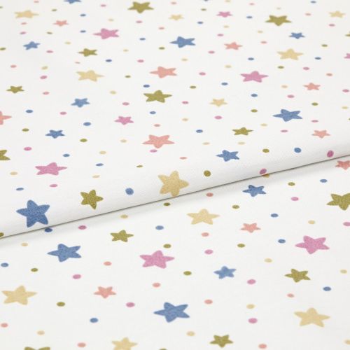 White cotton fabric with pastel star-and-dot print, folded and lying flat; small five-point stars and dots in blue, pink, yellow, olive; studio close-up, soft even lighting.