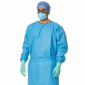 Person wearing a surgical gown, facemask, cap, and gloves.